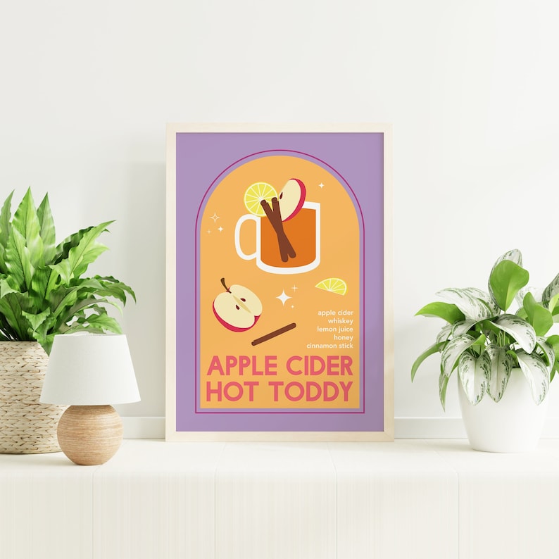May include: A purple and orange illustrated poster with a mug of apple cider hot toddy. The ingredients are listed: apple cider, whiskey, lemon juice, honey, and cinnamon stick. The text reads "Apple Cider Hot Toddy".