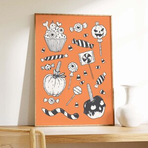 May include: An orange background with black and white illustrations of Halloween treats, including a cupcake, candy corn, lollipops, a pumpkin, and an apple.