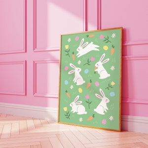 May include: A green background with white bunnies, carrots, and colorful Easter eggs. The bunnies are in various poses, some holding carrots, some hopping, and some sitting. The background is filled with small white flowers and green leaves.