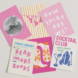 May include: A collection of colorful greeting cards with various designs. One card features a disco ball, another has a bikini on a clothesline, and a third says "How Lucky Are We?" Other cards include cowboy boots, a cocktail, and a library card that says "Read More Books."