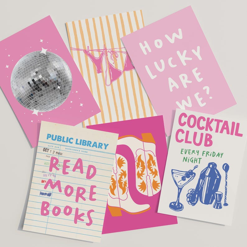 May include: A collection of colorful greeting cards with various designs. One card features a disco ball, another has a bikini on a clothesline, and a third says "How Lucky Are We?" Other cards include cowboy boots, a cocktail, and a library card that says "Read More Books."