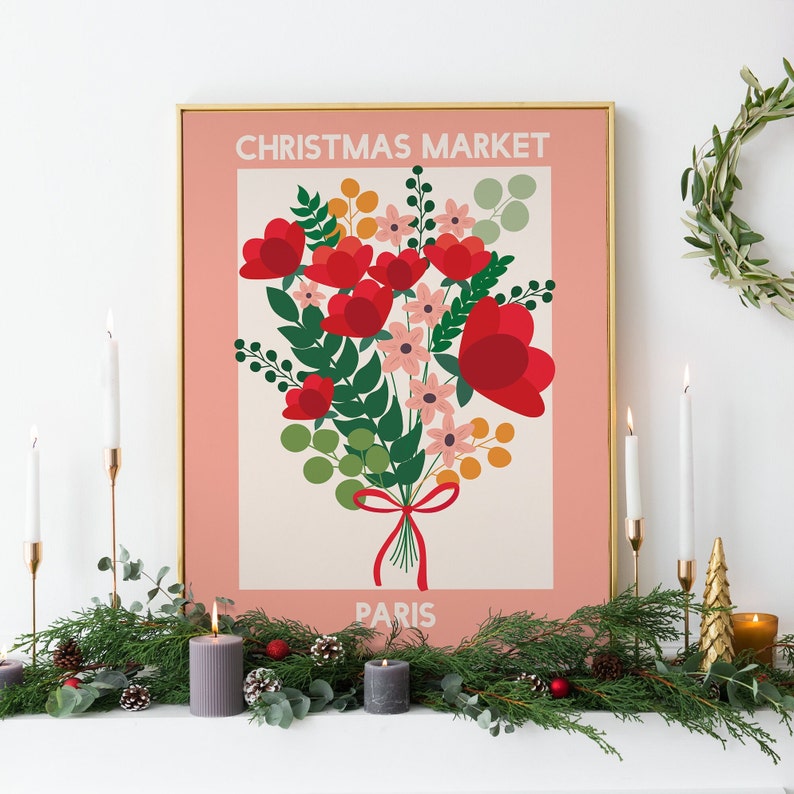 May include: A pink and white poster with a gold frame featuring a bouquet of red and pink flowers with green leaves. The poster says "Christmas Market Paris" at the top and bottom.