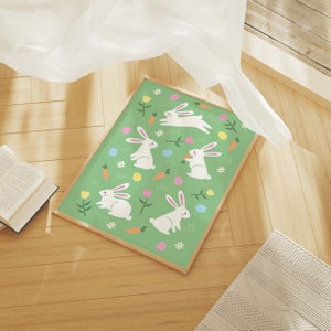 May include: A green background with white bunnies and colorful Easter eggs. The bunnies are holding carrots and some are hopping.