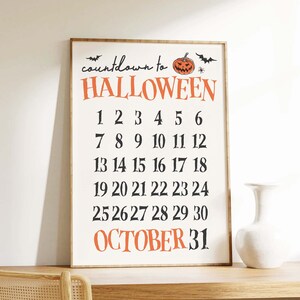 May include: A white printable sign with black text that says "countdown to HALLOWEEN" with a cartoon orange pumpkin and bats. The sign has a countdown of the days of October, with the number 31 highlighted in orange.