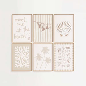 May include: Six framed art prints with a beach theme. The prints feature illustrations of a seashell, palm trees, beach items, and a bikini hanging on a clothesline. One print has the text "meet me at the beach". The color palette is beige and tan.