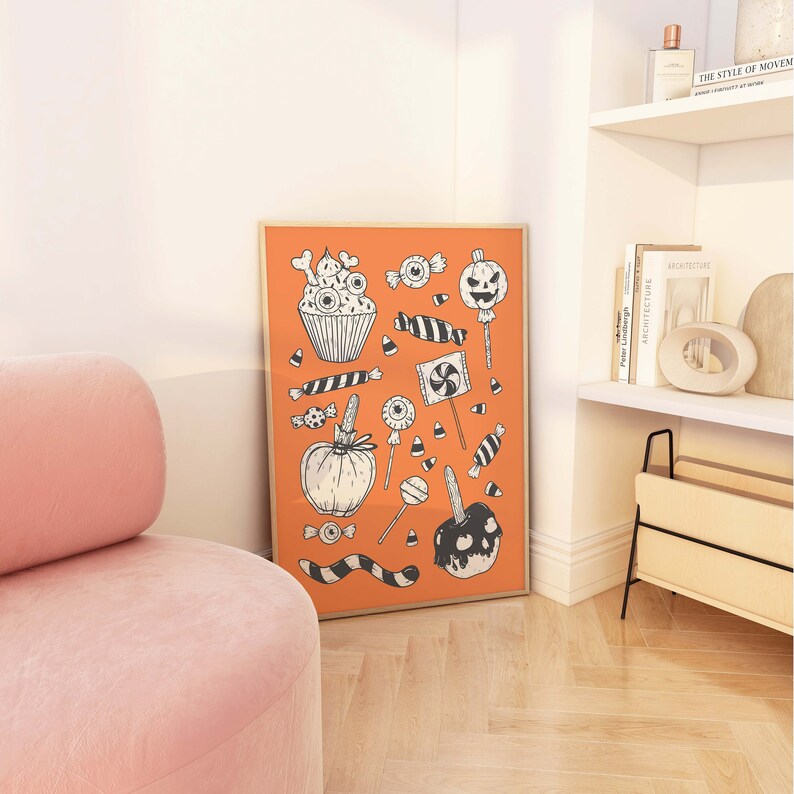 May include: An orange poster with black and white illustrations of Halloween candy, including a cupcake, a pumpkin, candy corn, lollipops, and a caramel apple.