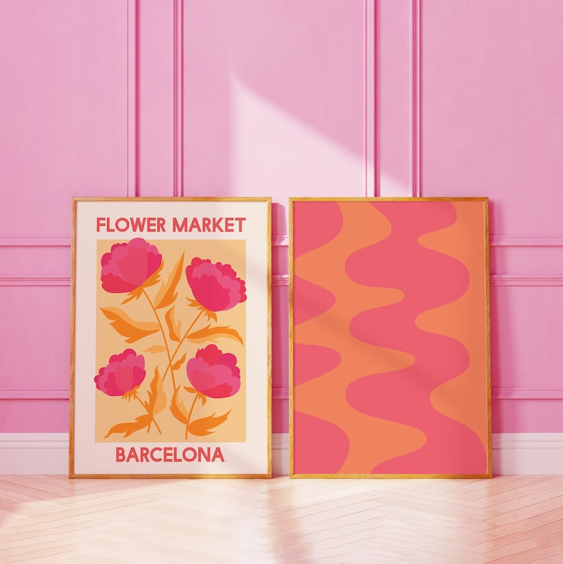 May include: Two framed prints, one with a floral design and the text "FLOWER MARKET BARCELONA" and the other with a wavy abstract pattern in pink and orange.