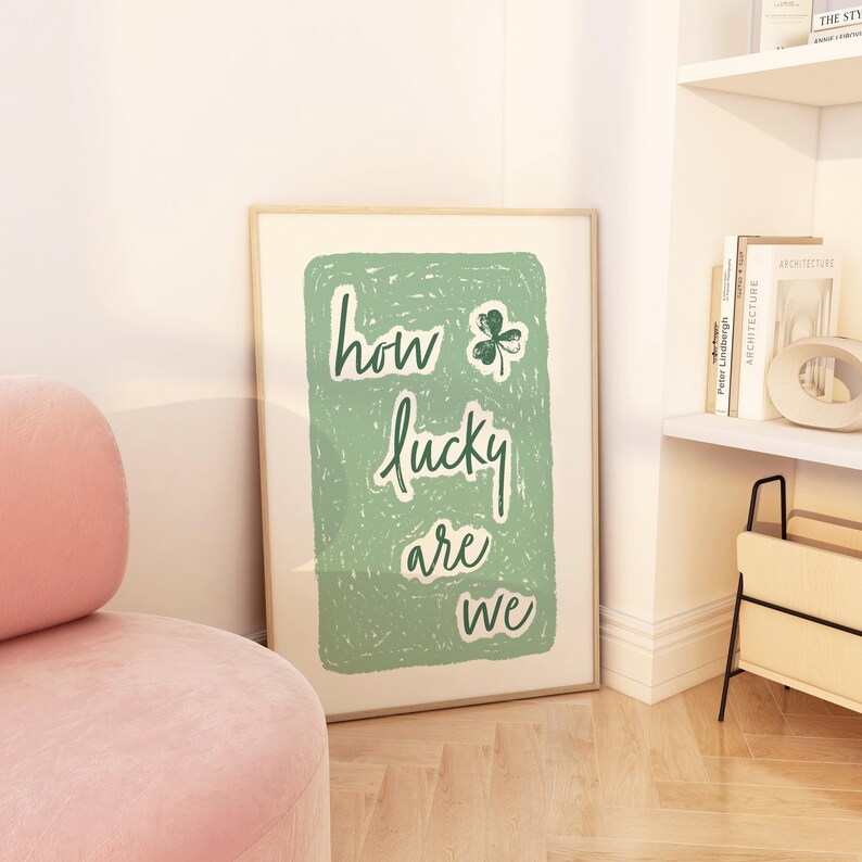 May include: A green and white poster with the text "how lucky are we" and a green shamrock.