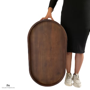 A large, oval-shaped wooden serving ottoman Tray / Topper / Table Top