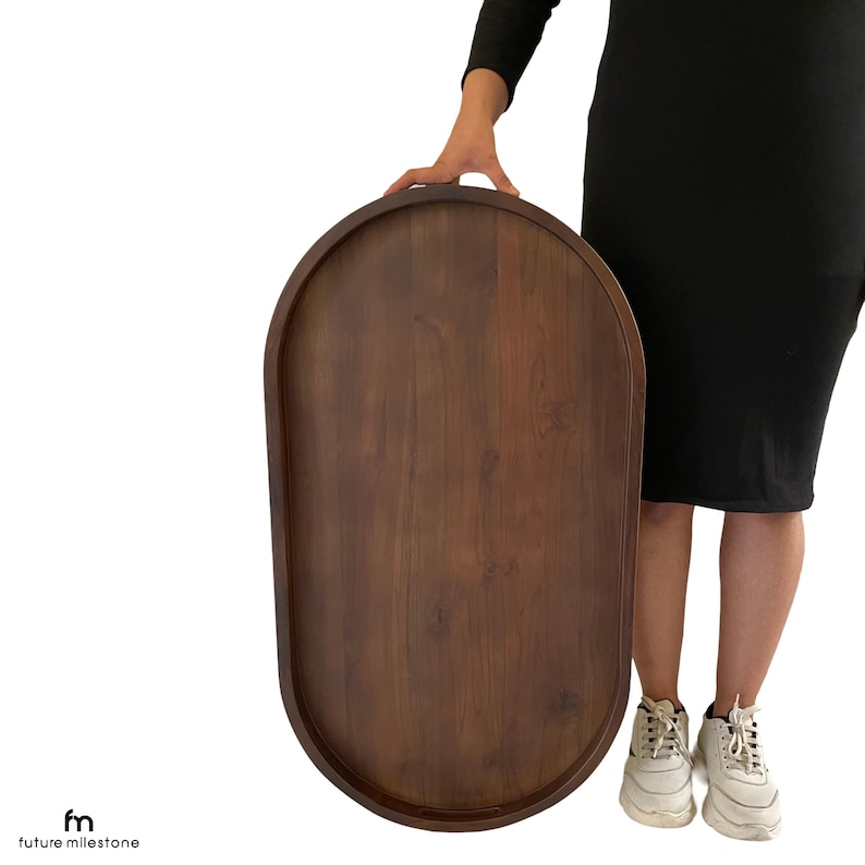 A large, oval-shaped wooden serving ottoman Tray / Topper / Table Top