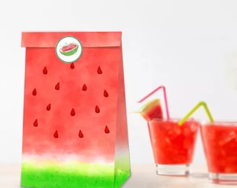May include: A red and green watermelon-themed paper gift bag with a sticker of a watermelon slice. The bag is sitting on a white surface with two glasses of red liquid and straws.