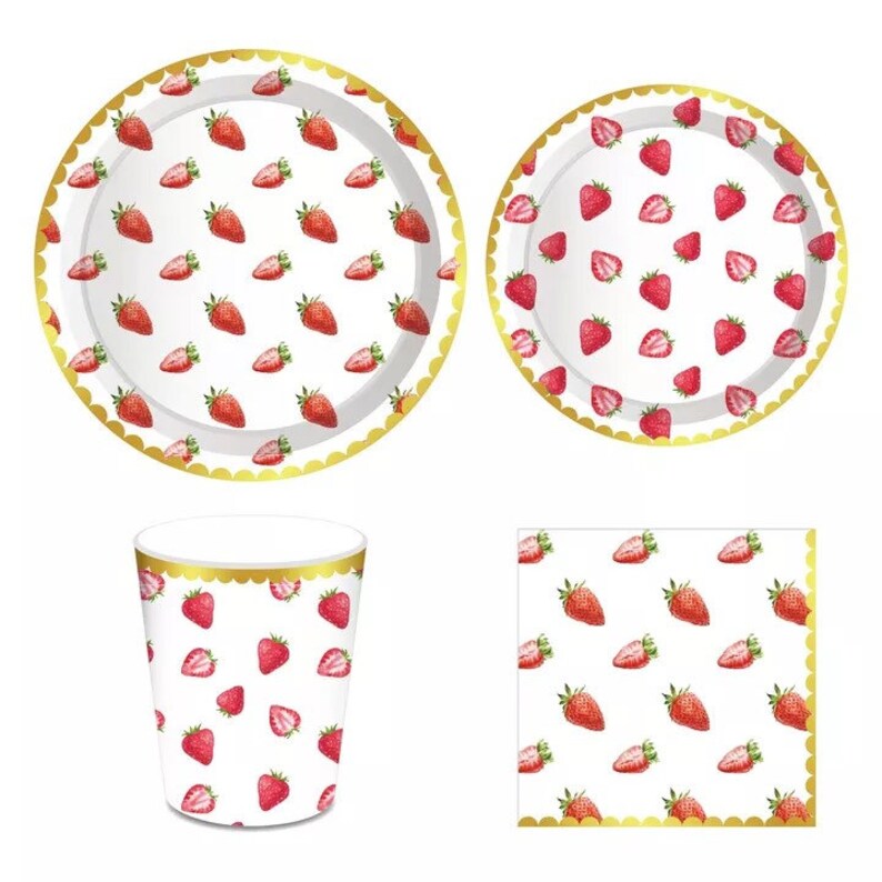 May include: A set of disposable party supplies featuring a strawberry pattern. The set includes two paper plates, one paper cup, and one paper napkin. The plates and napkin have a gold trim.