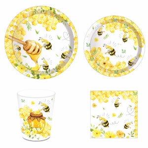 May include: A set of bee-themed party supplies, including a large and small paper plate, a paper cup, and a paper napkin. The plates and napkin feature a white background with yellow honeycomb, bees, and flowers. The cup has a white background with a bee, honeycomb, and a jar of honey.