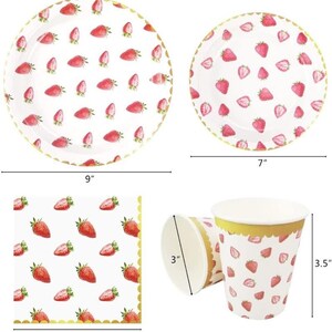 May include: A set of disposable party supplies featuring a strawberry pattern. The set includes 9-inch and 7-inch plates, 3-inch cups, and 12.6-inch napkins.