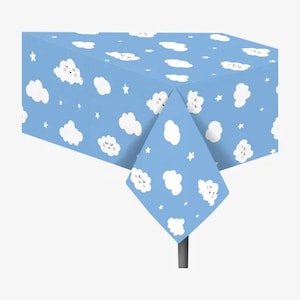 May include: A blue plastic tablecloth with a repeating pattern of white clouds with smiling faces and white stars.