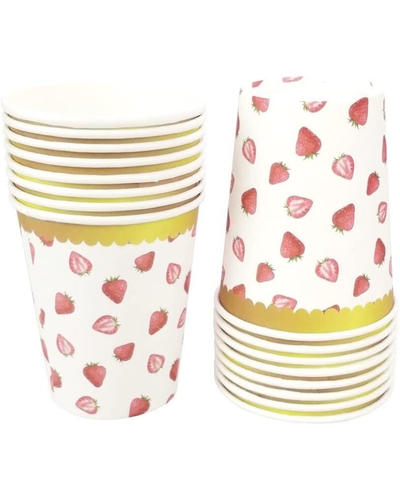 May include: A stack of 10 white paper cups with a gold rim and a strawberry pattern. The cups are perfect for parties, picnics, or everyday use.