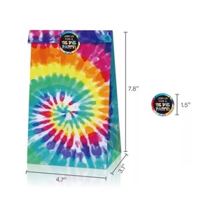 May include: A colorful tie-dye party favor bag, 4.7" wide, 3.1" deep, and 7.8" tall, with a matching sticker, 1.5" in diameter. The bag and sticker feature a vibrant swirl of rainbow colors. The sticker reads "Join us for a Tie Dye Party!"