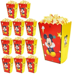May include: Set of 10 red and yellow popcorn boxes featuring Mickey Mouse. Each box has a scalloped edge and a Mickey Mouse design with stars and a yellow background. The boxes are ideal for parties or movie nights.
