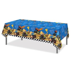 May include: Blue plastic tablecloth with a checkered border. The tablecloth features a repeating pattern of monster trucks driving on a dirt track. The text "Monster Truck" is repeated on the tablecloth.