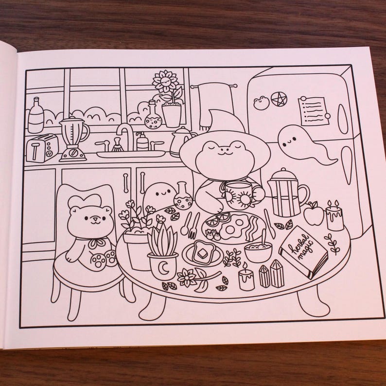 May include: A black and white line drawing of a kitchen scene with a frog, a bear, and a ghost. The frog is sitting at a table with a cup of tea and a plate of food. The bear is sitting in a chair next to the table. The ghost is floating in the air above the table. The table is set with a book that says "Herbal Magic".