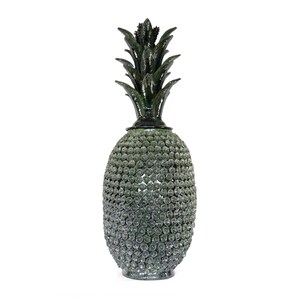 May include: A decorative pineapple-shaped ornament with a beaded body and a dark green leafy top. The pineapple is approximately 46 cm tall, with a dark base and a detailed, textured surface.