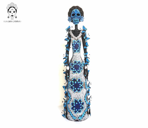 blue catrina dress Catrina with blue dress and pink flowers made of polychrome clay Tikal