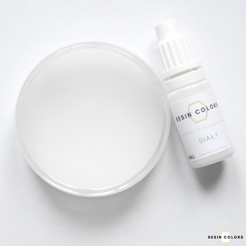 May include: A white resin pigment and a clear plastic container filled with white resin. The pigment bottle is labeled "Resin Colors" and "BIAŁY". The image is on a white background.