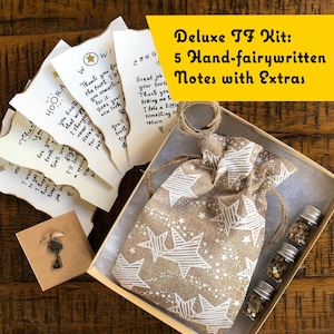 May include: A brown box with a burlap bag with white stars, four small glass bottles with glitter, and five handwritten notes with a key charm. The box has a label that reads "Deluxe TF Kit: 5 Hand-fairywritten Notes with Extras".