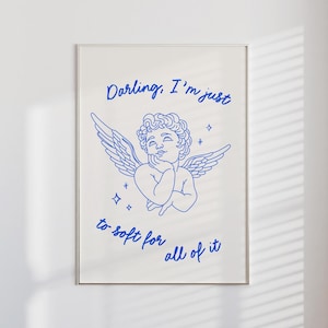 Puede incluir: Un dibujo de línea azul de un querubín con alas, con el texto "Darling, I'm just to soft for all of it" en cursiva azul.