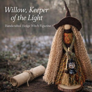 May include: A handcrafted Hedge Witch figurine with long, light brown hair and a brown hat. The witch holds a lantern and broom. A scroll lies nearby. The text reads "Willow, Keeper of the Light."