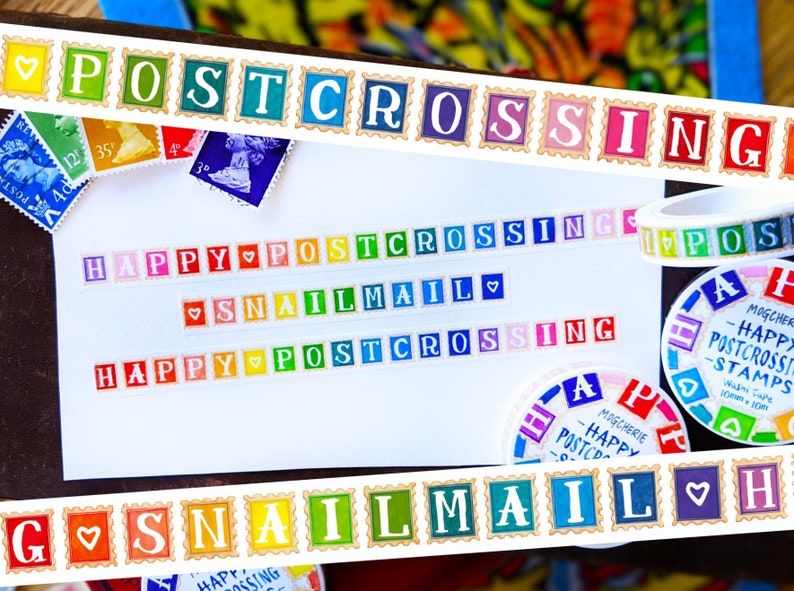 May include: A white card with colorful washi tape borders. The tape features the words "POSTCROSSING", "SNAILMAIL", and "HAPPY POSTCROSSING".