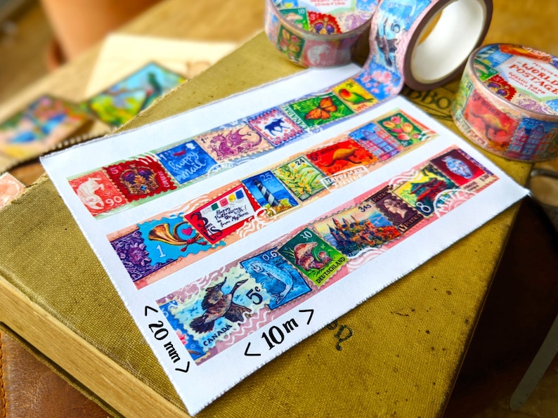 May include: Four rolls of colorful washi tape with a vintage postage stamp design. The tape is 20 mm wide and 10 meters long. The tape features images of animals, flowers, and buildings.