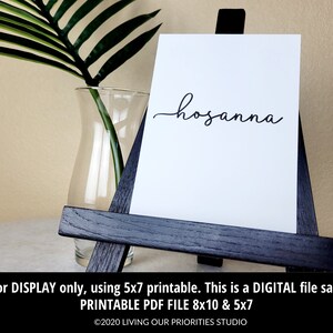 May include: Printable digital file of the word "hosanna" in a cursive font. The file is available in 8x10 and 5x7 inch sizes.