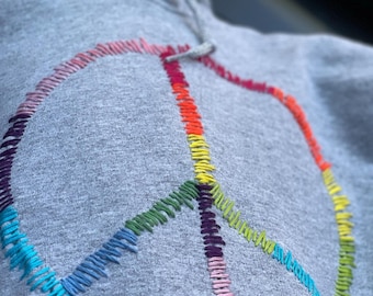 Hand embroidered peace sign hoodie