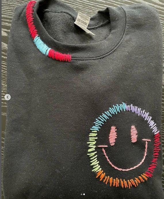 Embroidered smiley face sweatshirt hotsell