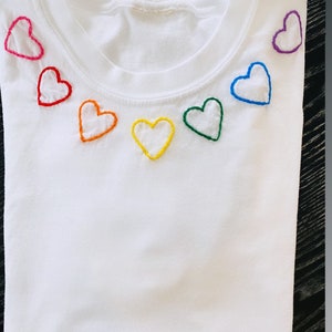 Hand embroidered rainbow hearts tshirt