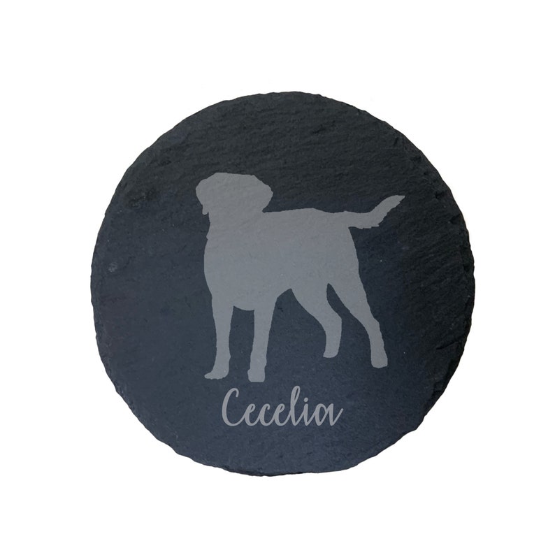 May include: A black slate round coaster with a gray silhouette of a dog and the name "Cecelia" engraved in gray.