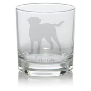 May include: A clear glass tumbler with an etched silhouette of a dog and the name "Emma" at the bottom.