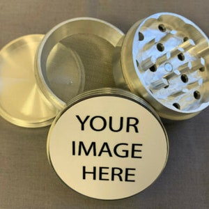 May include: Three silver metal grinder pieces with a mesh screen and a blank white piece with the text "YOUR IMAGE HERE".