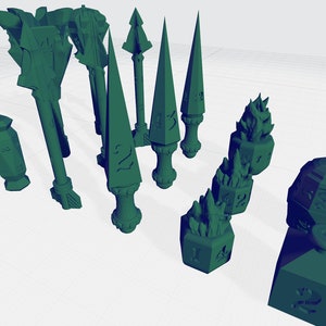 Könnte beinhalten: Ein Satz grüner, 3D-gedruckter Würfel mit verschiedenen Designs, darunter ein Schädel, eine Flamme und ein Speer. Die Würfel sind aus glattem Kunststoff gefertigt und haben eine matte Oberfläche.