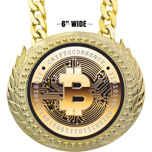 May include: Gold-colored Bitcoin pendant necklace, 6 inches wide, with a large Bitcoin symbol in the center. The pendant is round, with the word "CRYPTOCURRENCY" around the Bitcoin symbol. The necklace has a thick gold chain.