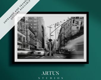 May include: Black and white photograph of a busy city street in New York City. The image features tall buildings, traffic, and a street sign that reads "48th Street".