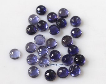 May include: A collection of 25 round, smooth, purple gemstones. The gemstones are approximately 6mm in diameter and have a slightly iridescent finish.