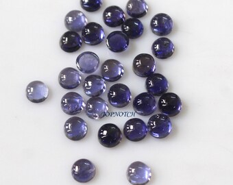 May include: A collection of 25 round, smooth, purple and blue gemstone cabochons. The cabochons are approximately 6mm in diameter and have a polished, shiny finish.