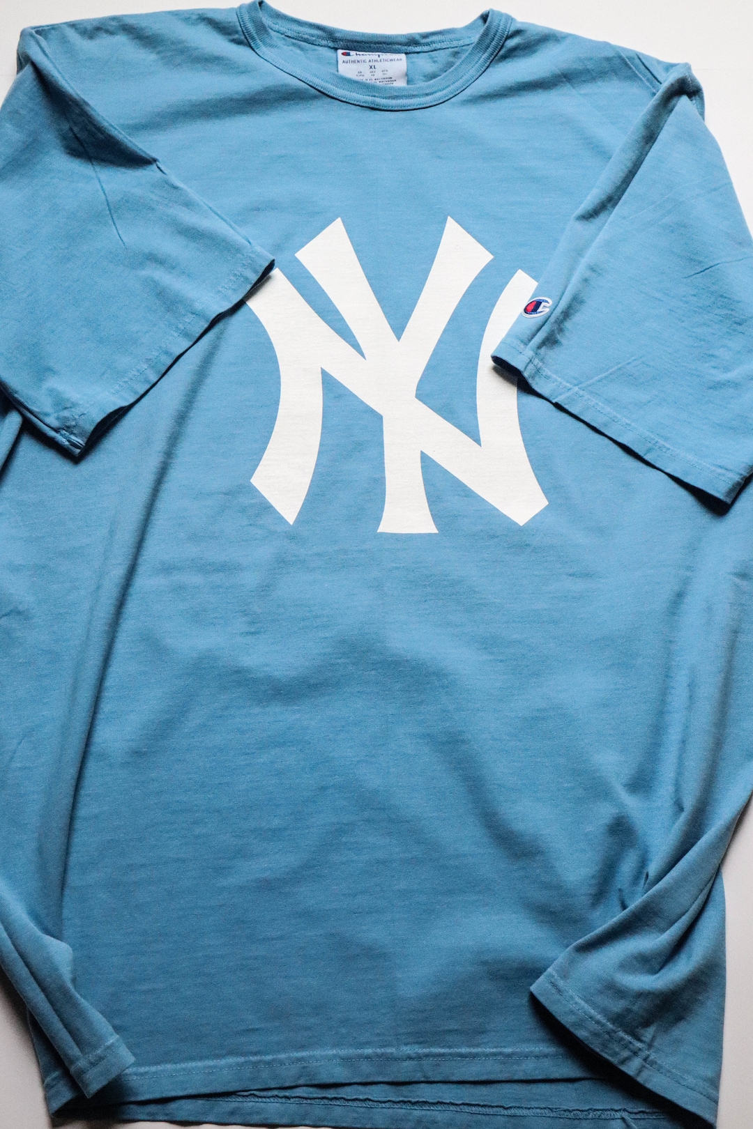 light blue yankees shirt