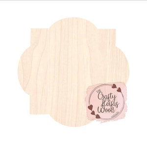 May include: A blank, unfinished, wooden cutout in the shape of a flower with five rounded petals. The cutout is made of light-colored wood with a natural grain pattern. The cutout is surrounded by a white background. The text "The Crafty Heifer Wood Cutouts" is printed in brown text on a pink background with a heart design.