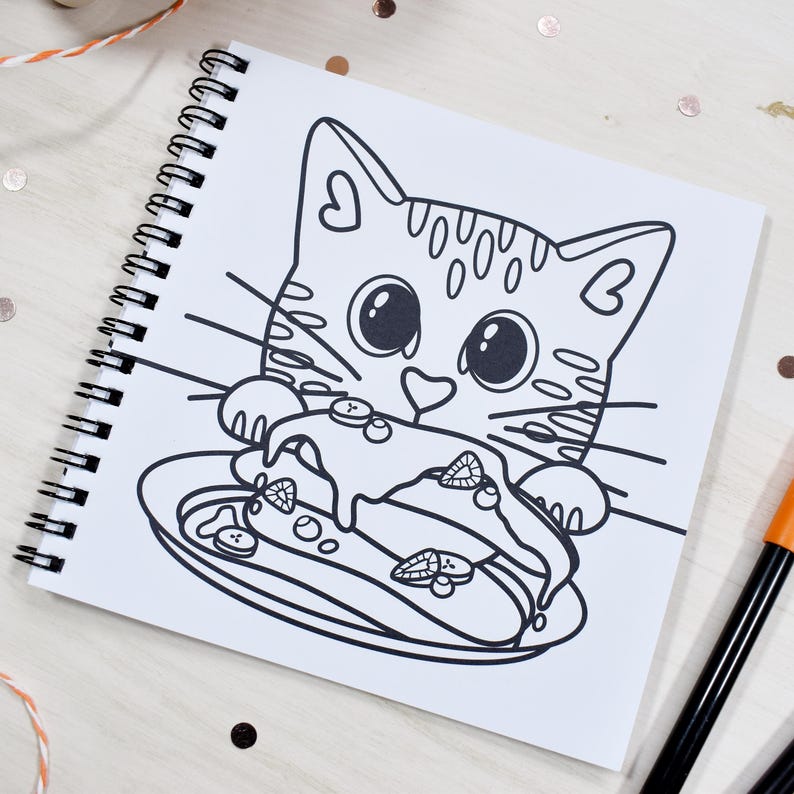 May include: Spiral-bound coloring book featuring a black and white illustration of a cartoon cat holding a plate of food. The cat has large eyes and a heart-shaped nose. The food on the plate includes strawberries and blueberries.