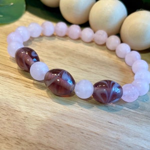Beaded bracelets | handmade bracelets | stretchy bracelets | elastic bracelet | Light pink accented by precious purple and pink beads
