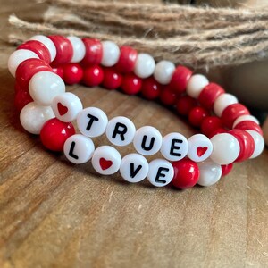 Beaded handmade bracelet for women | stretchy bracelet | elastic bracelet | red and neutral beads accented by heart beads