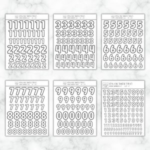May include: Six sheets of black and white printable royal icing transfer templates with numbers 0-9. Each sheet has a different set of numbers with a bold outline.